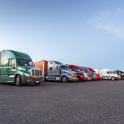 several trucks parked in parking lot_canstockphoto21151162 800x533
