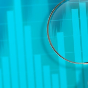 monitoring trends_magnifying glass over business charts_canstockphoto14227903 800x315